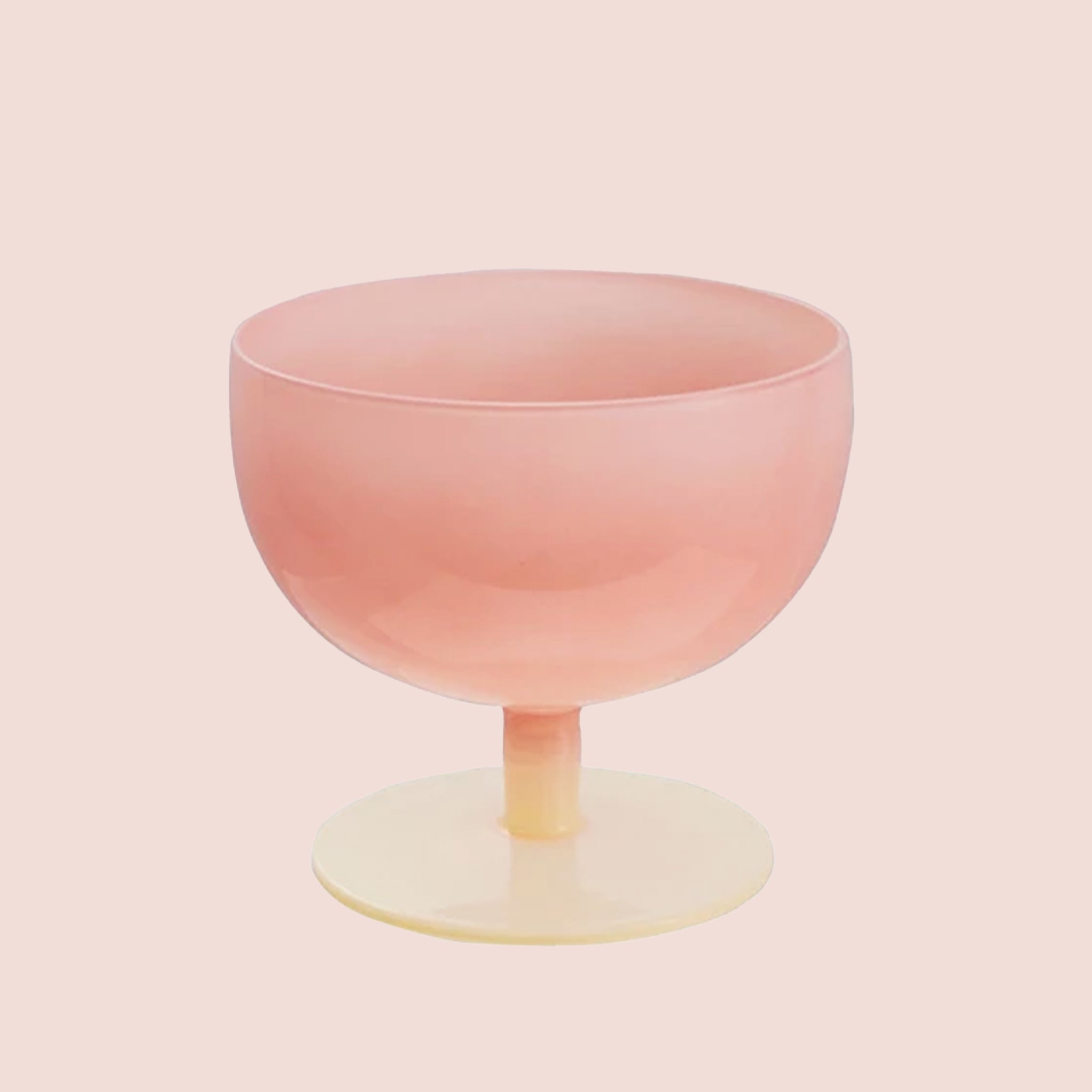 A pink and cream two toned wine glass.