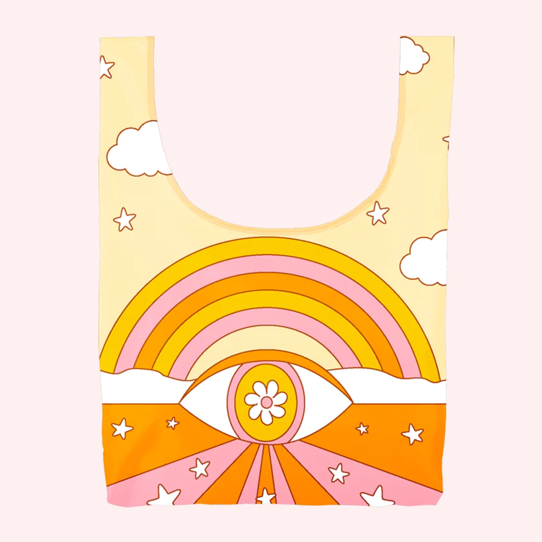 On a light pink background is yellow, orange and pink nylon reusable bag with a rainbow and all-seeing eye print. 