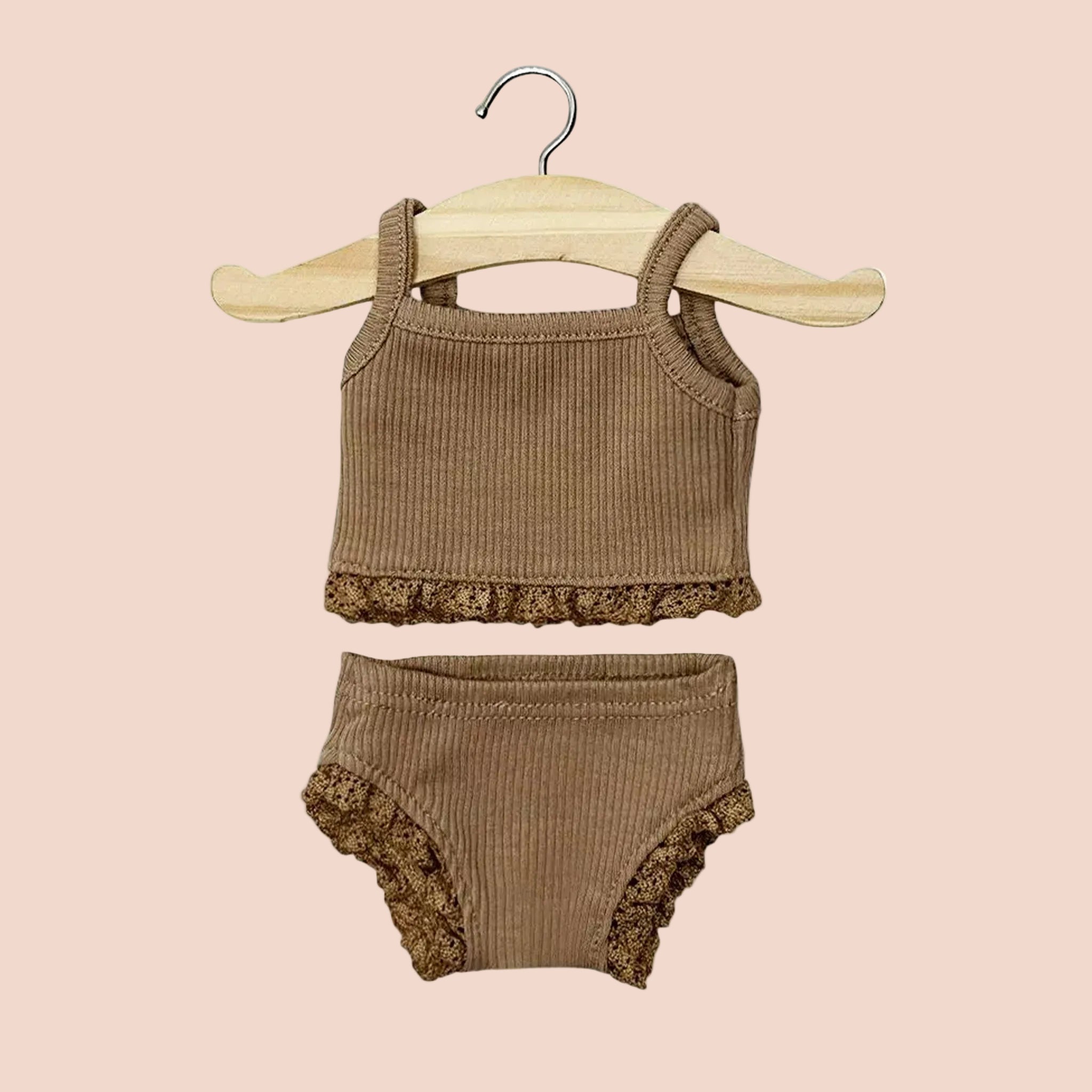 A chocolate brown doll set. 