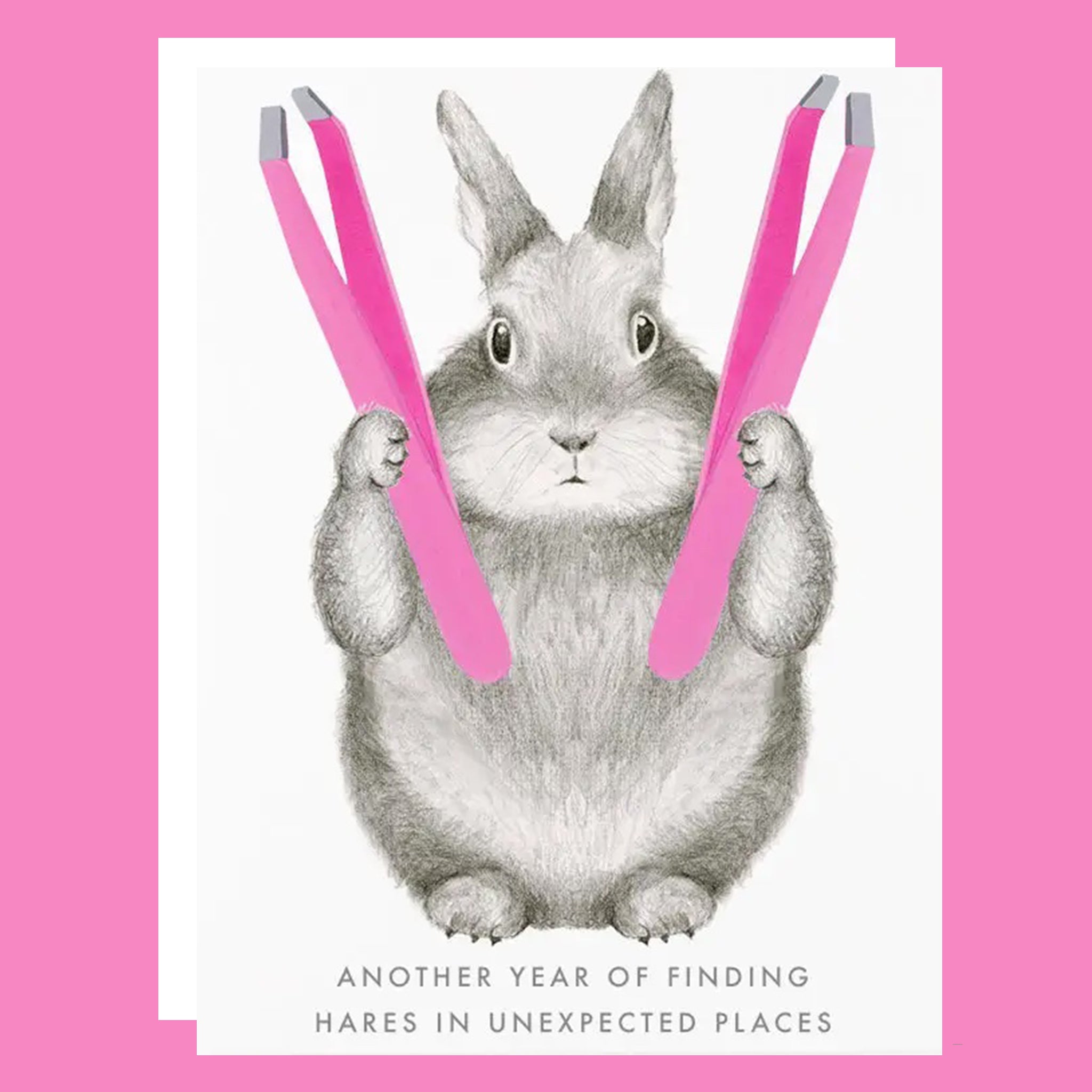 Greeting card with a bunny holding two pink tweezers. The card reads "Another year of finding hares in unexpected places".