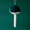On a dark green background is a teal mushroom ornament with a velvet fabric and small sequins on the top