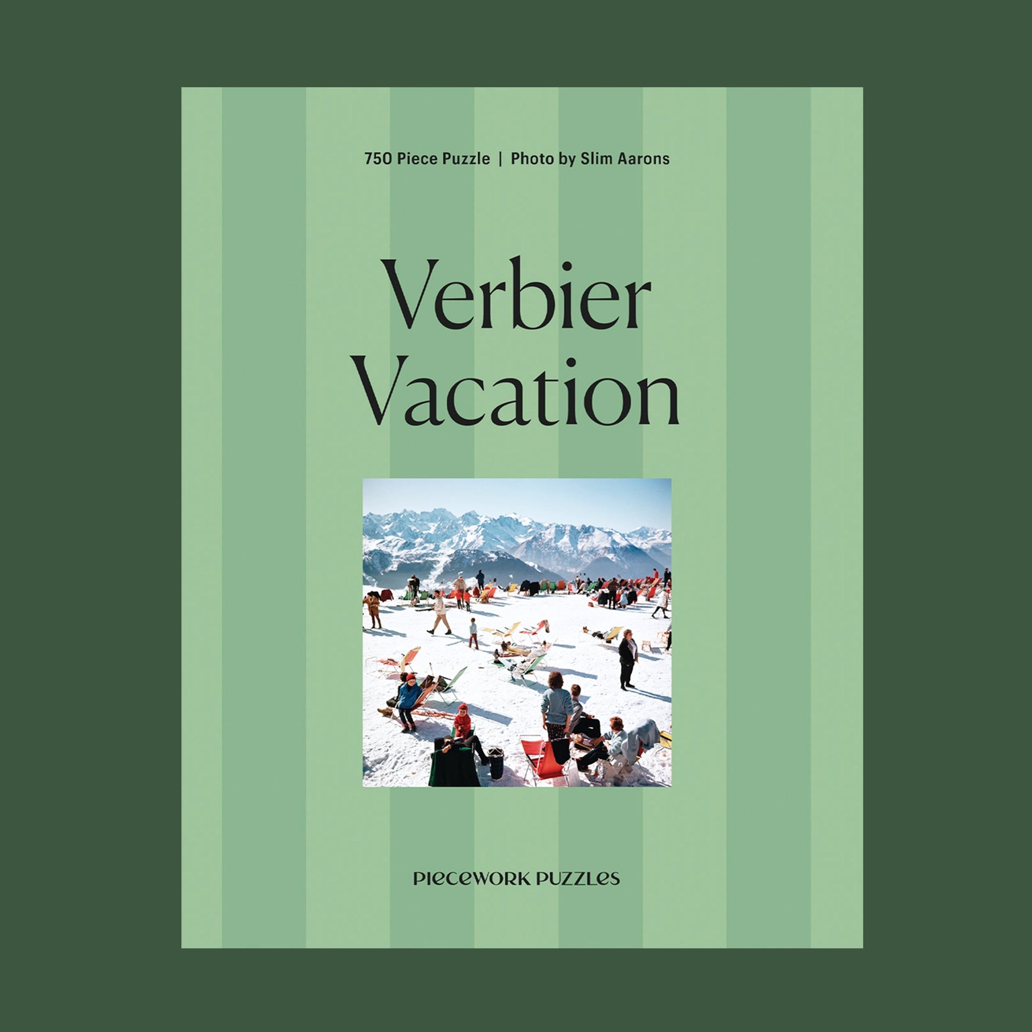 "Verbier Vacation Piecework Puzzle". A green striped puzzle box with a photo of a snowy ski slopes image. 