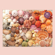 On a peachy background is a boxed puzzle with multi colored seashells. 