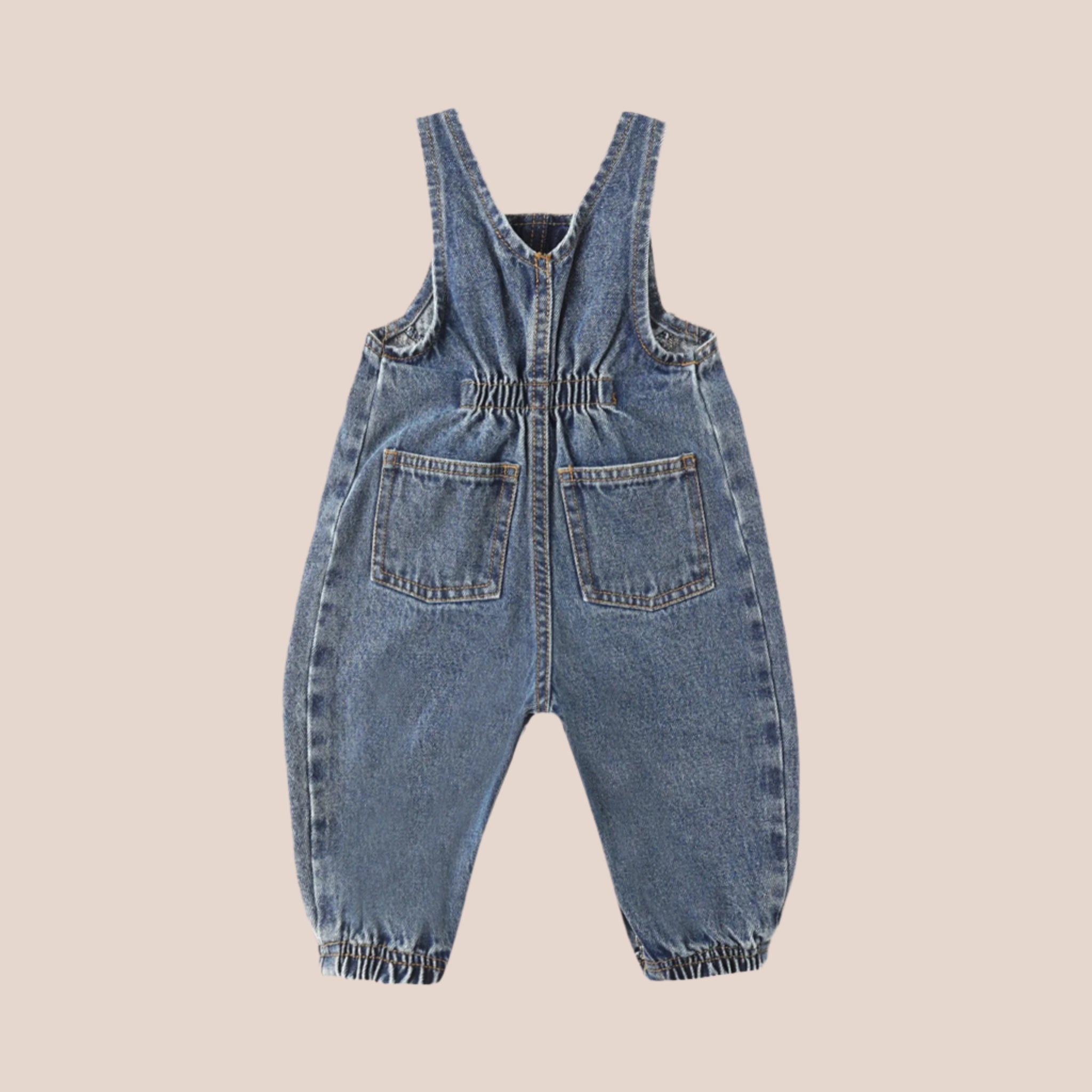 A pair of dark blue vintage inspired children&#39;s overalls. 