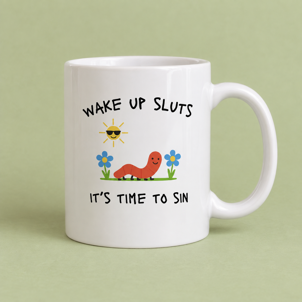 A mug that reads, "wake up sluts it's time to read".