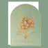 Greeting card with gold floral design and 'Well Wishes' text on a green background