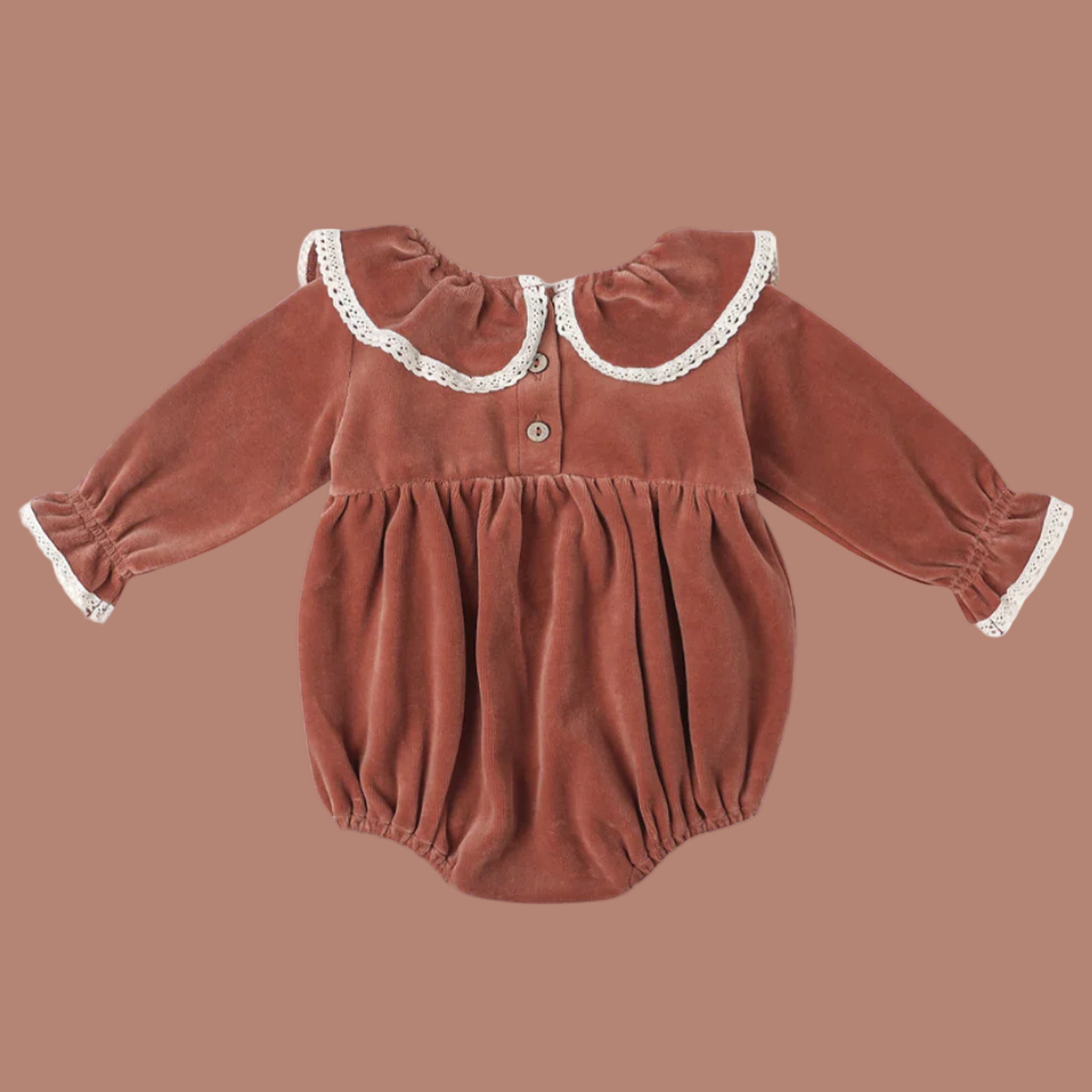 A cranberry colored velvet romper with a white lace ruffle neckline and sleeve. 