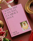 A hot pink book cover with black text that reads, 'What Art Can Tell Us About Love'. 