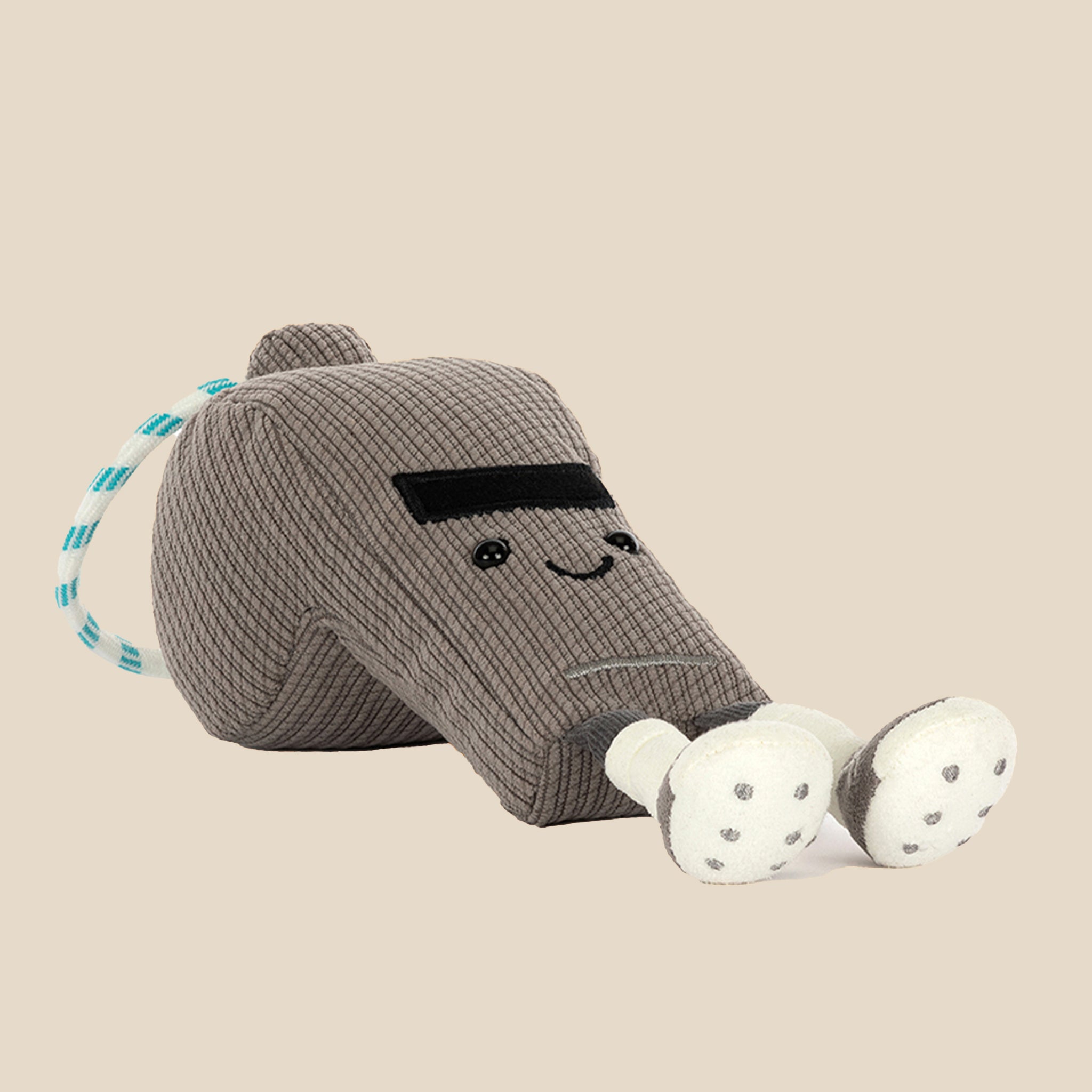 Gray knitted sock with a smiling face on a light gray background
