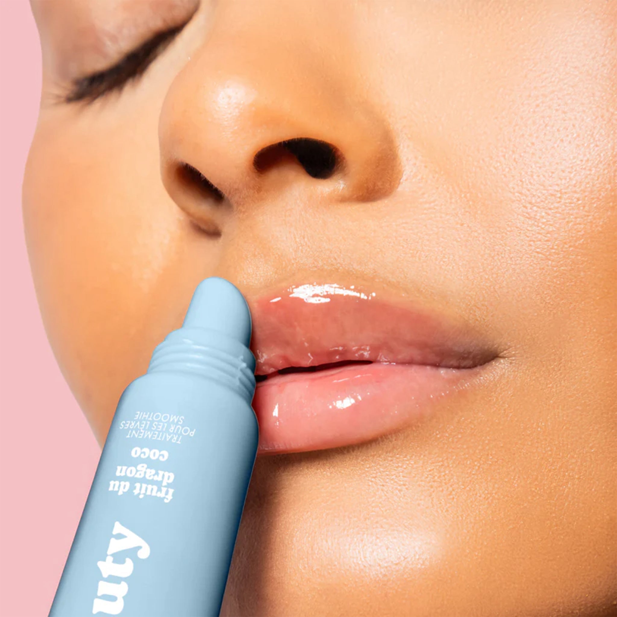 A white tube of lip butter with text that reads, 'White Pitaya Coconut Smoothie'