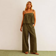 A pair of green and cream striped wide leg pants. 