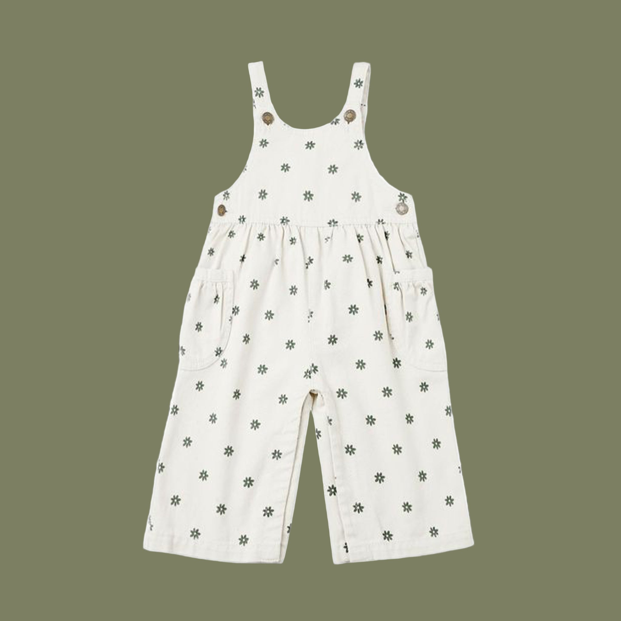 A pair of white wide leg overalls with green daisies. 