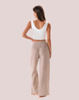 A wide leg cotton pant with a stretch waistband in a beige shade. 
