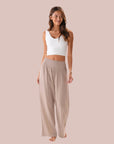 A wide leg cotton pant with a stretch waistband in a beige shade. 