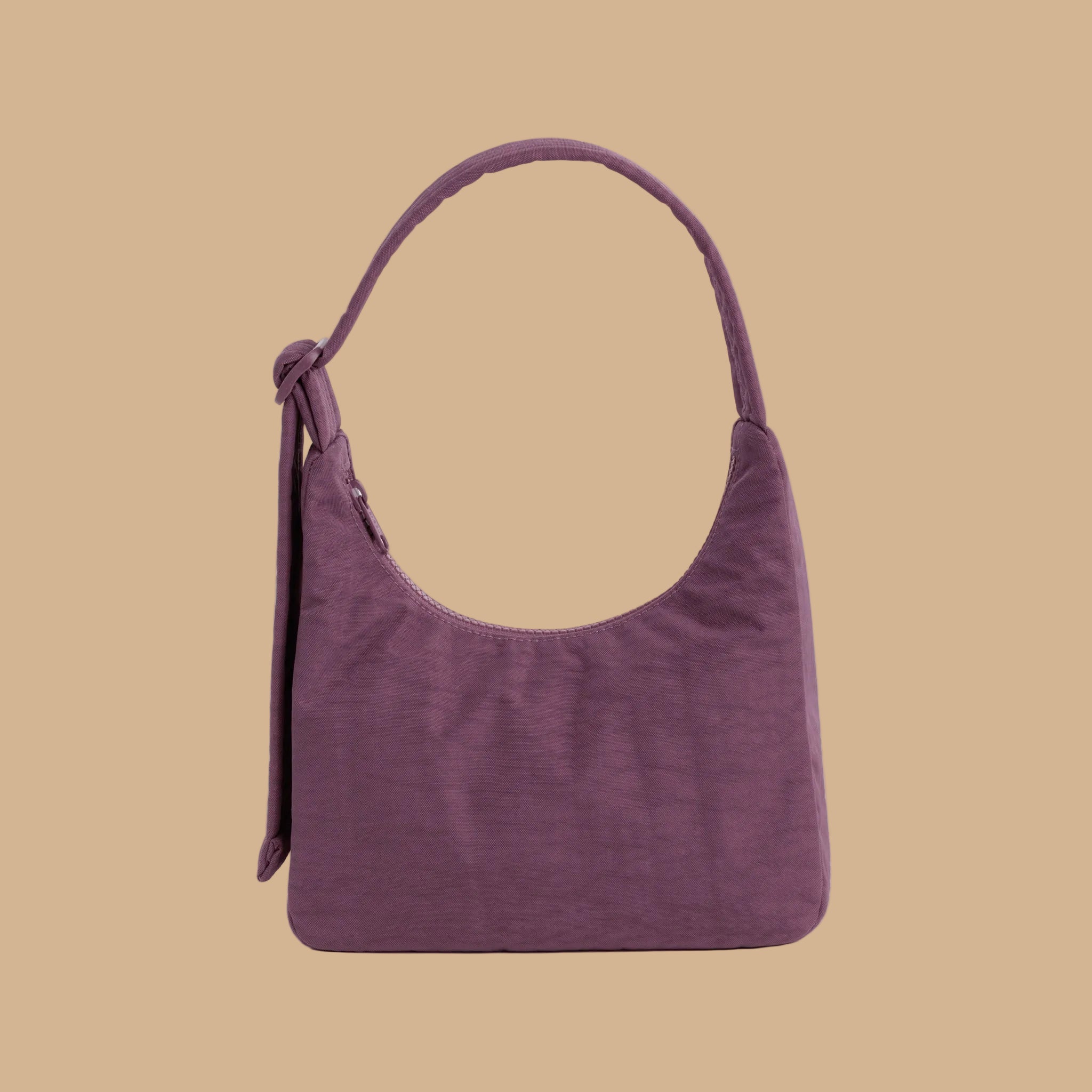 A purple nylon mini handbag.