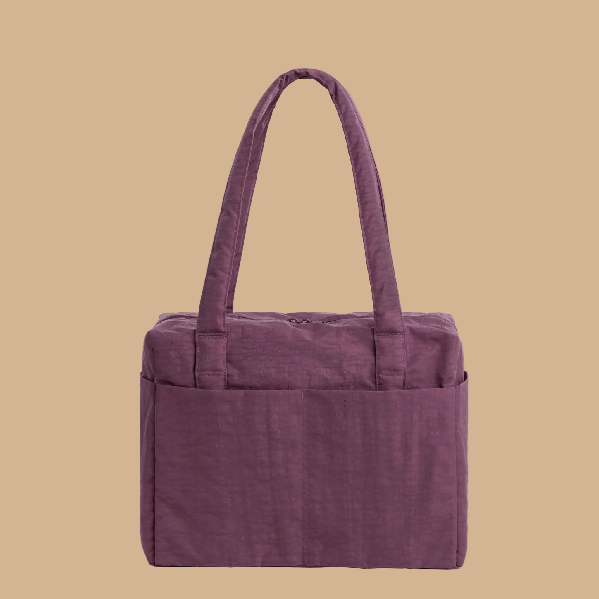 A purple nylon carry on bag.