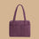 A purple nylon carry on bag.
