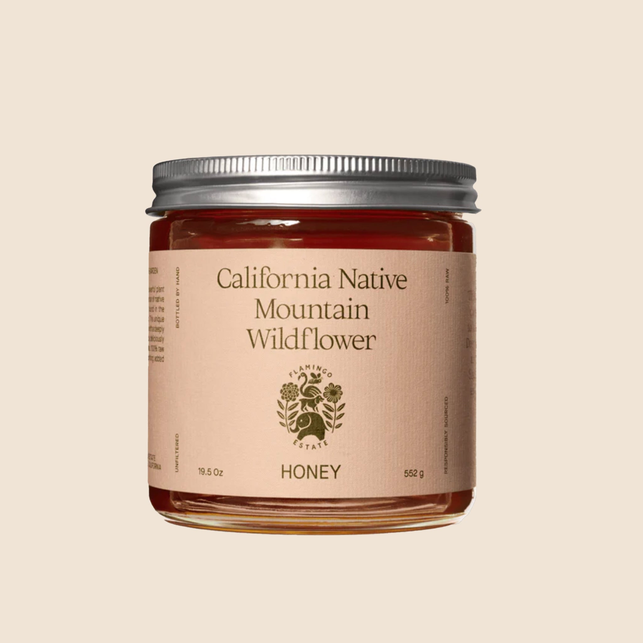 A glass jar of honey with a label that reads, "California Native Mountain Wildflower Honey". 