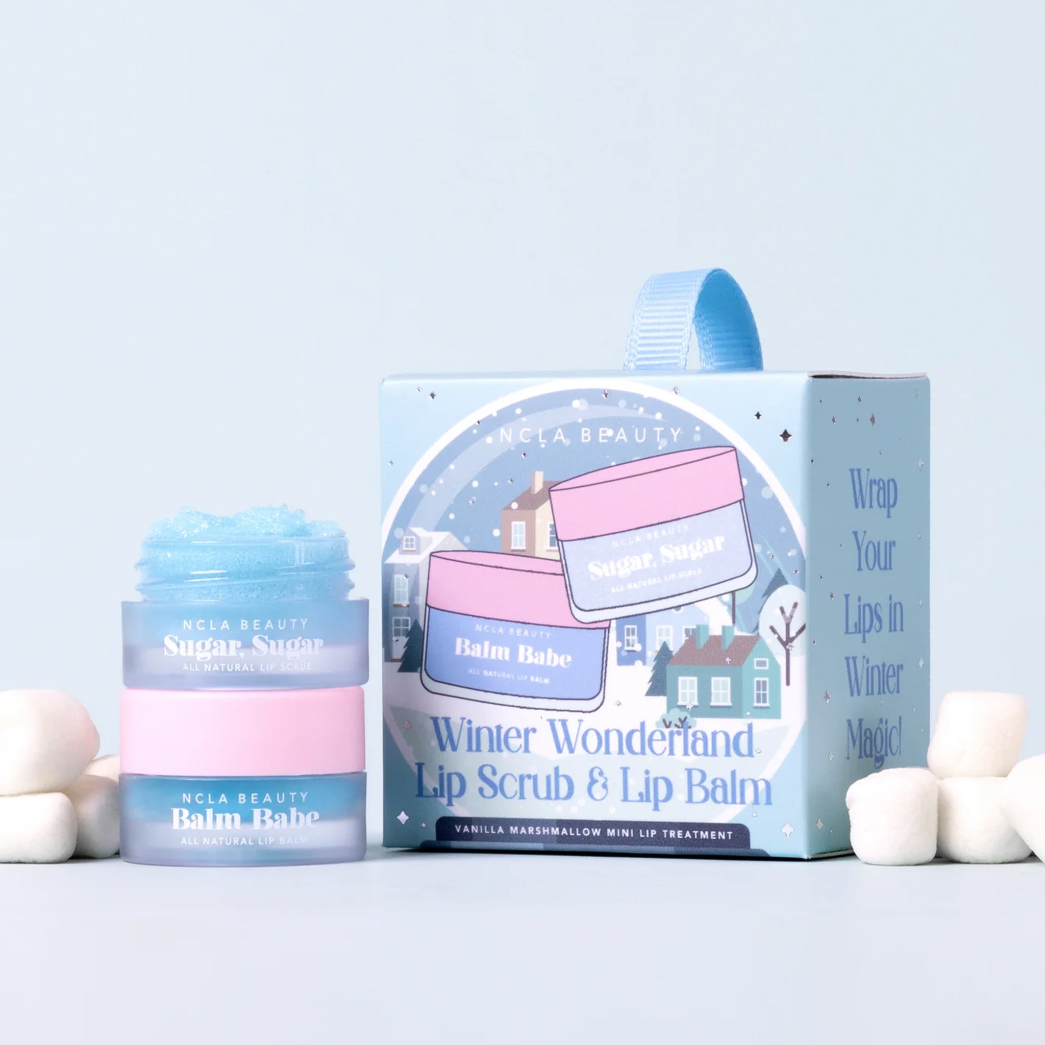 A set of lip balm and lip scrub with text on the packaging that reads, "Winter Wonderland Lip Scrub & Lip Balm".