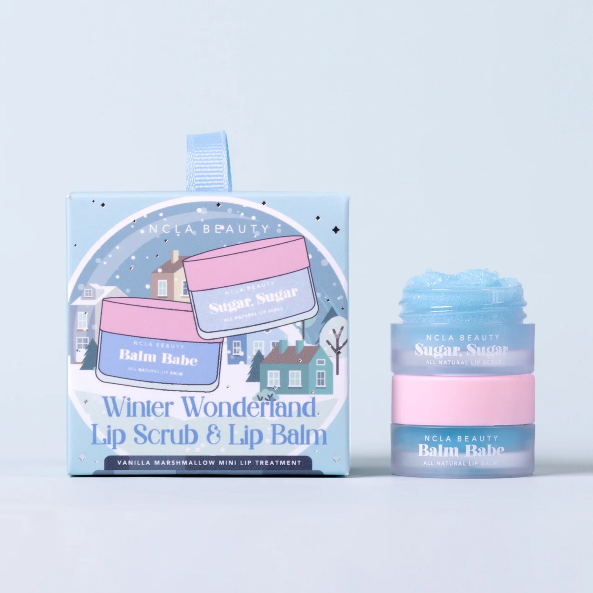 A set of lip balm and lip scrub with text on the packaging that reads, "Winter Wonderland Lip Scrub & Lip Balm".