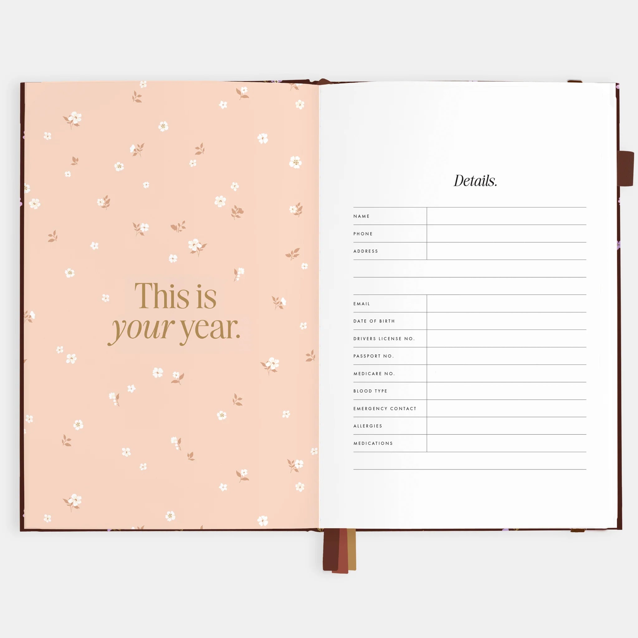&quot;This is your year&quot; on the left floral patterned page and, &quot;Details&quot; on the right page with lines for name, phone, address, and contact information. 