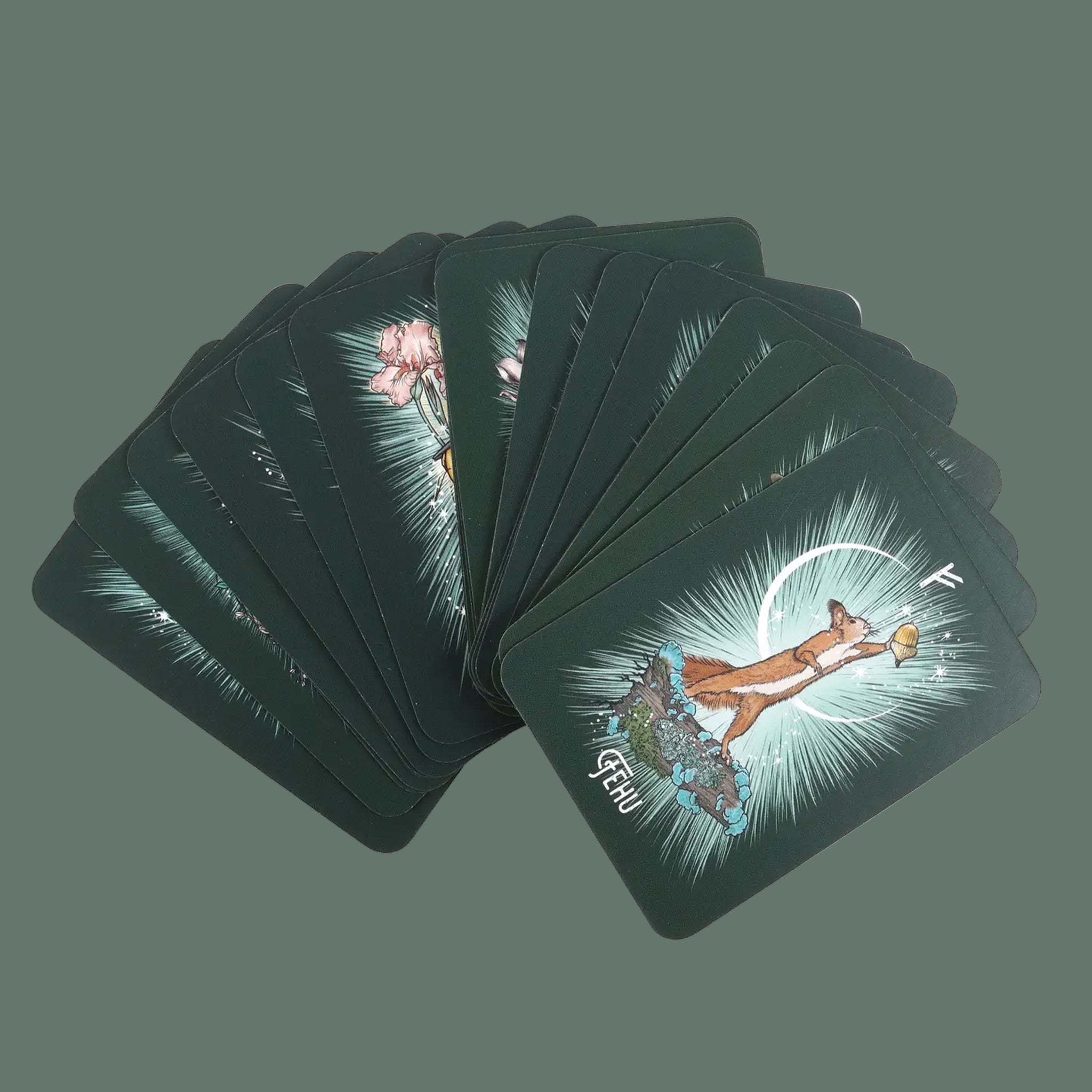 A green deck of witch themed oracle cards. 