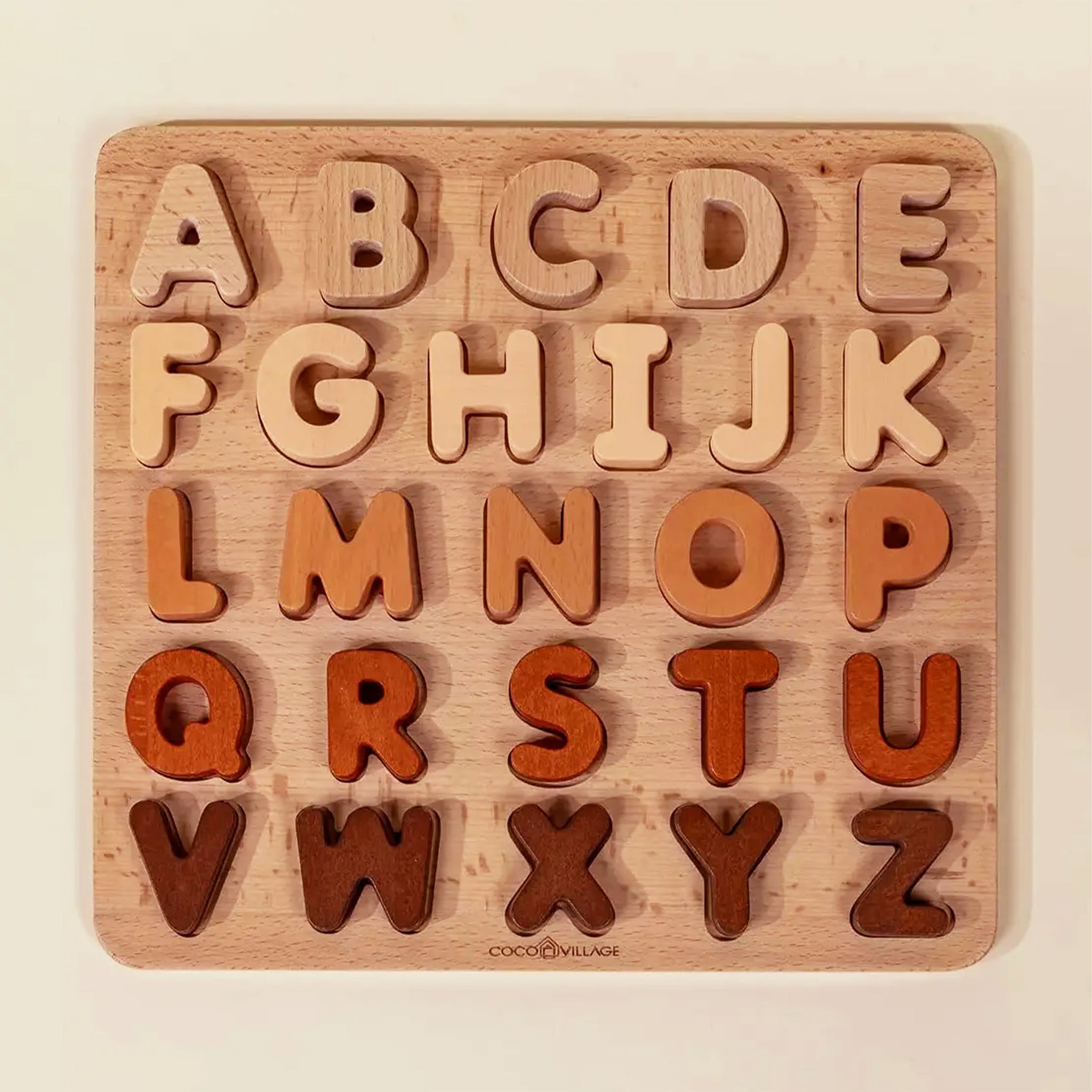 A wooden neutral alphabet puzzle toy. 