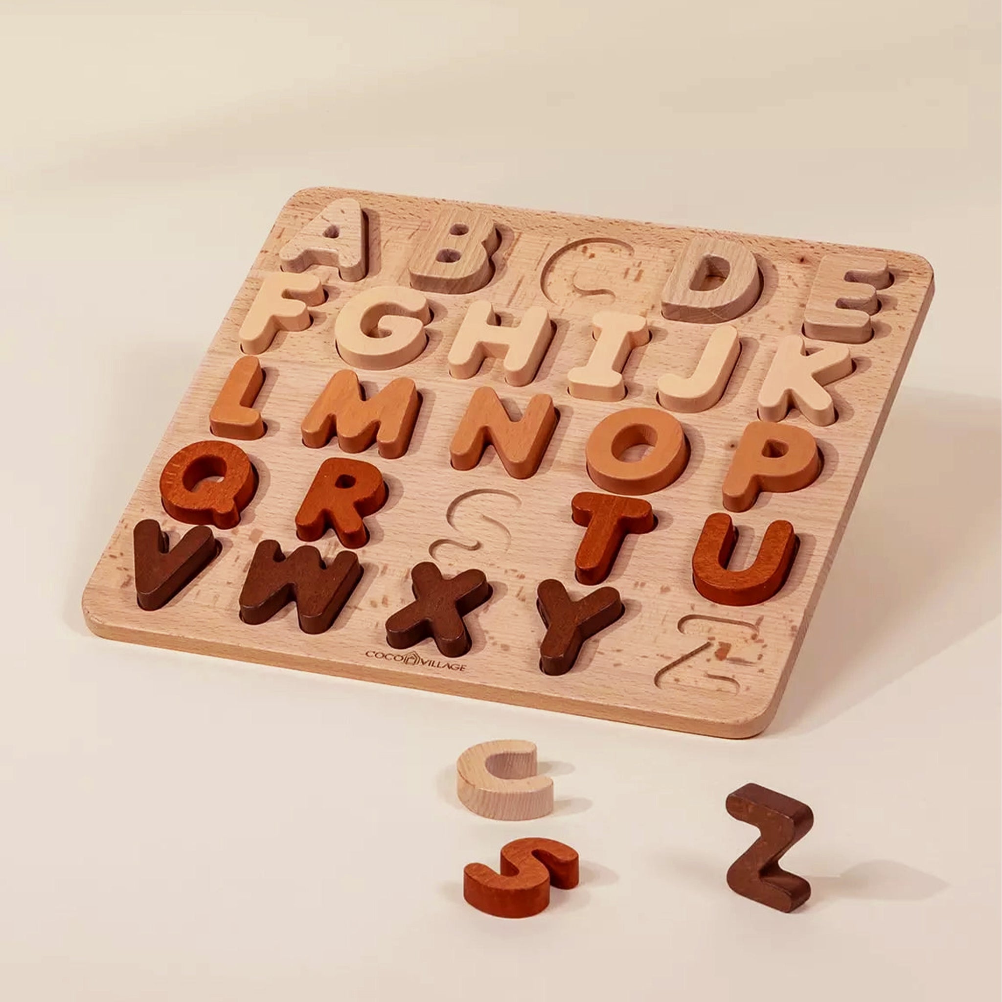 A wooden neutral alphabet puzzle toy. 