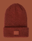 A reddish knit beanie. 
