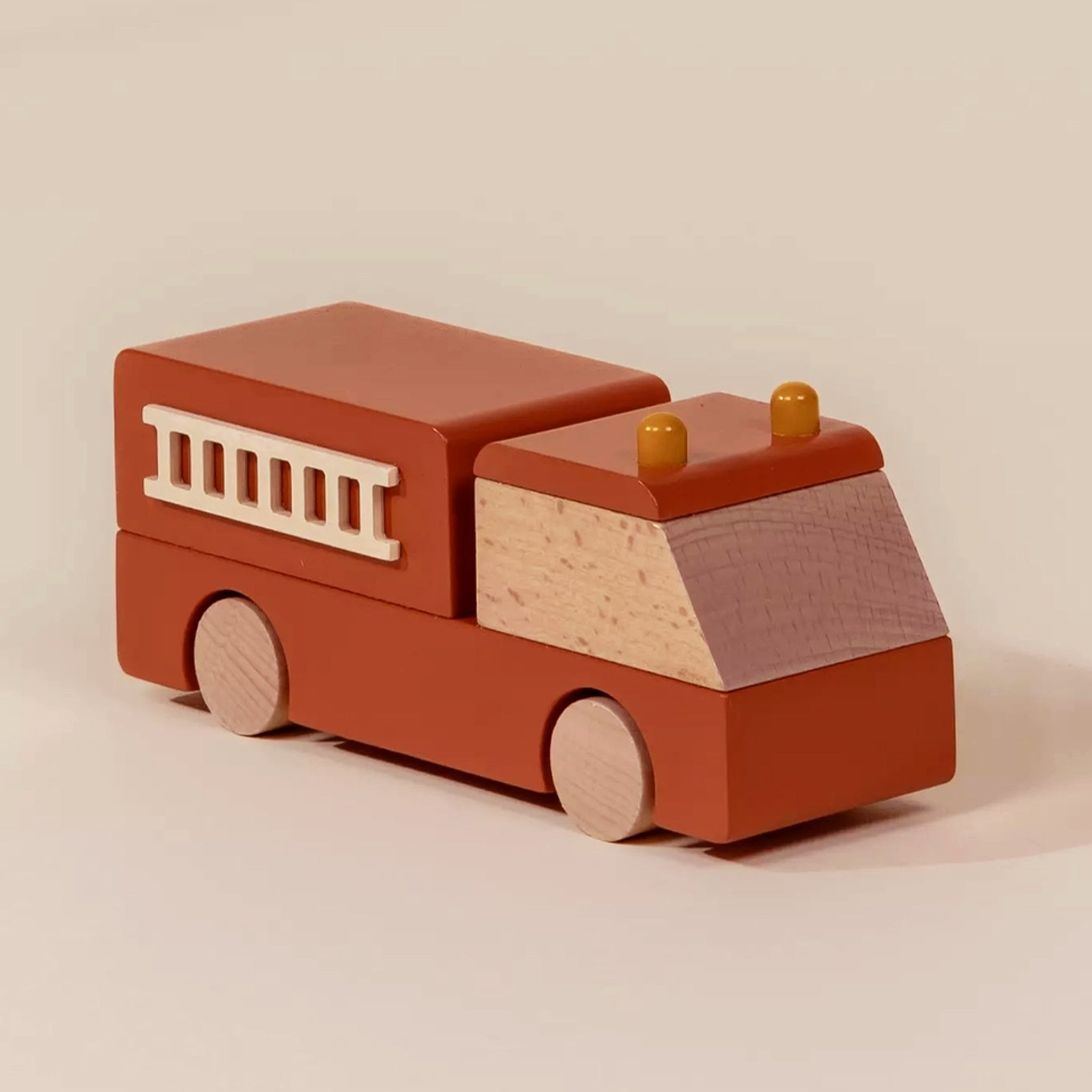 A wooden firetruck toy. 