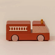 A wooden firetruck toy. 