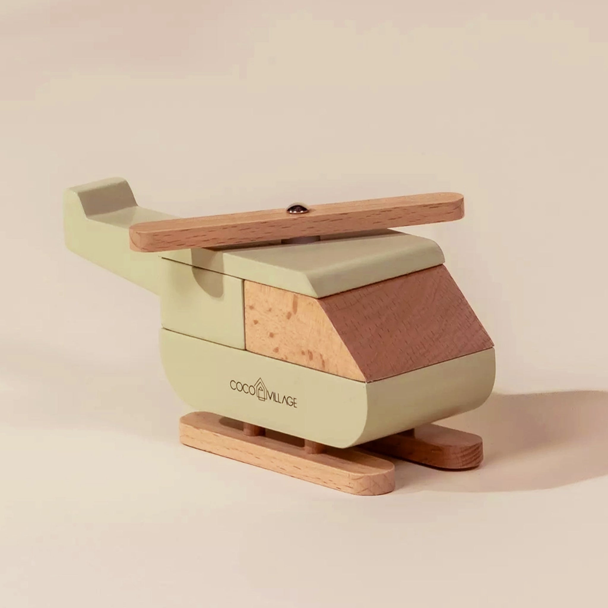 A wooden neutral helicopter shaped toy. 