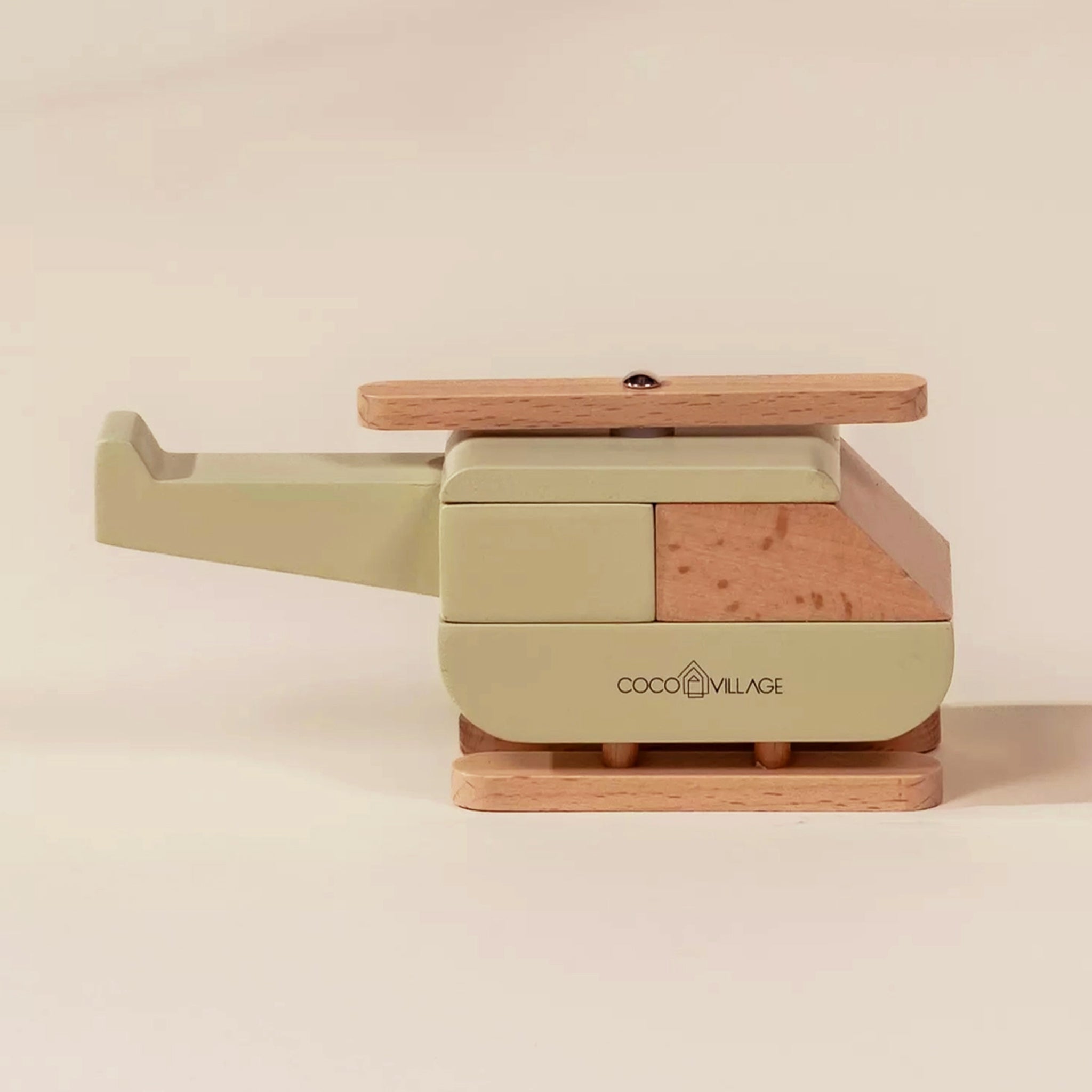 A wooden neutral helicopter shaped toy. 