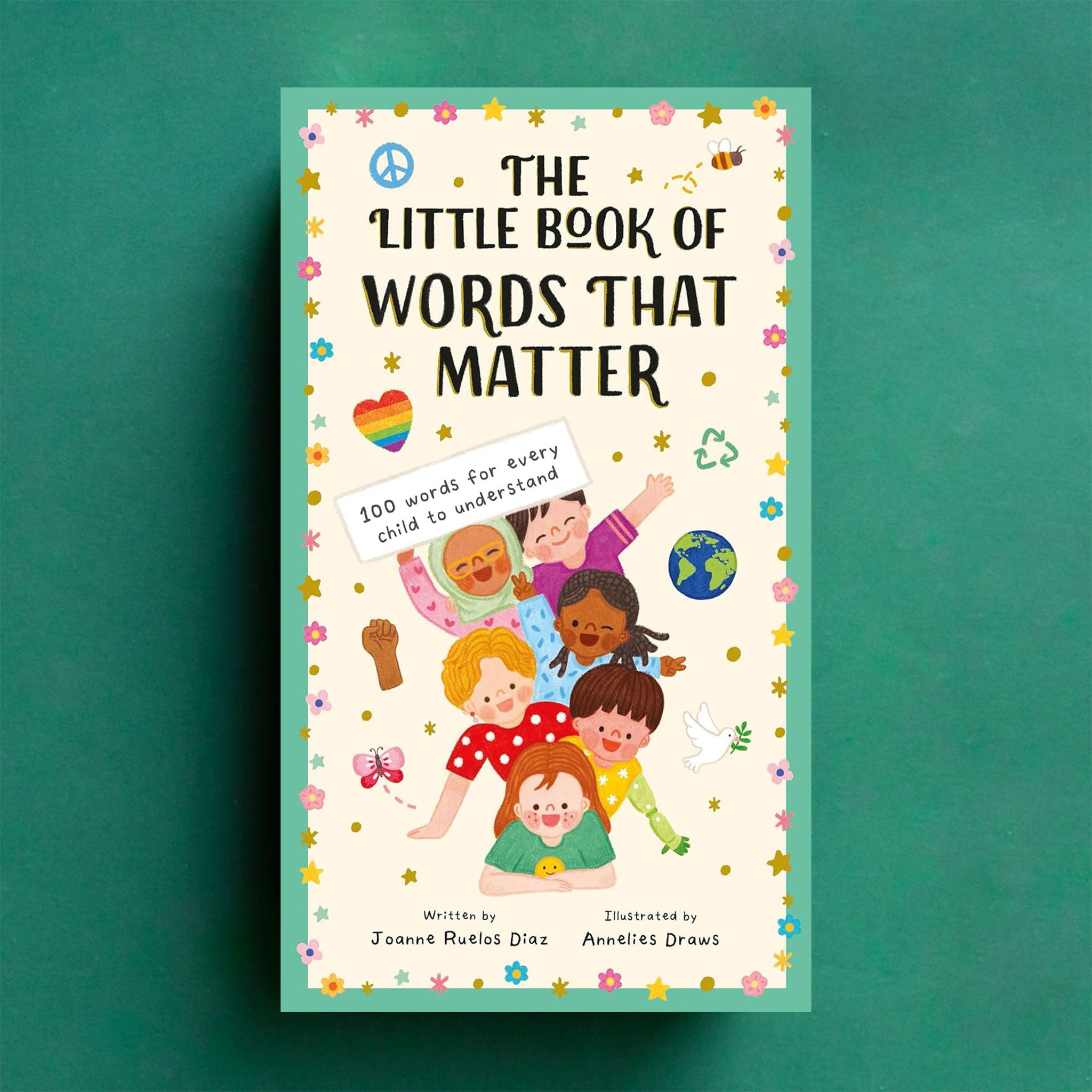 On a green background is a book with an illustration of children and the title at the top that reads, &quot;The Little Book of Words That Matter&quot;. 