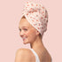 A light pink hair wrap with a cherry print. 