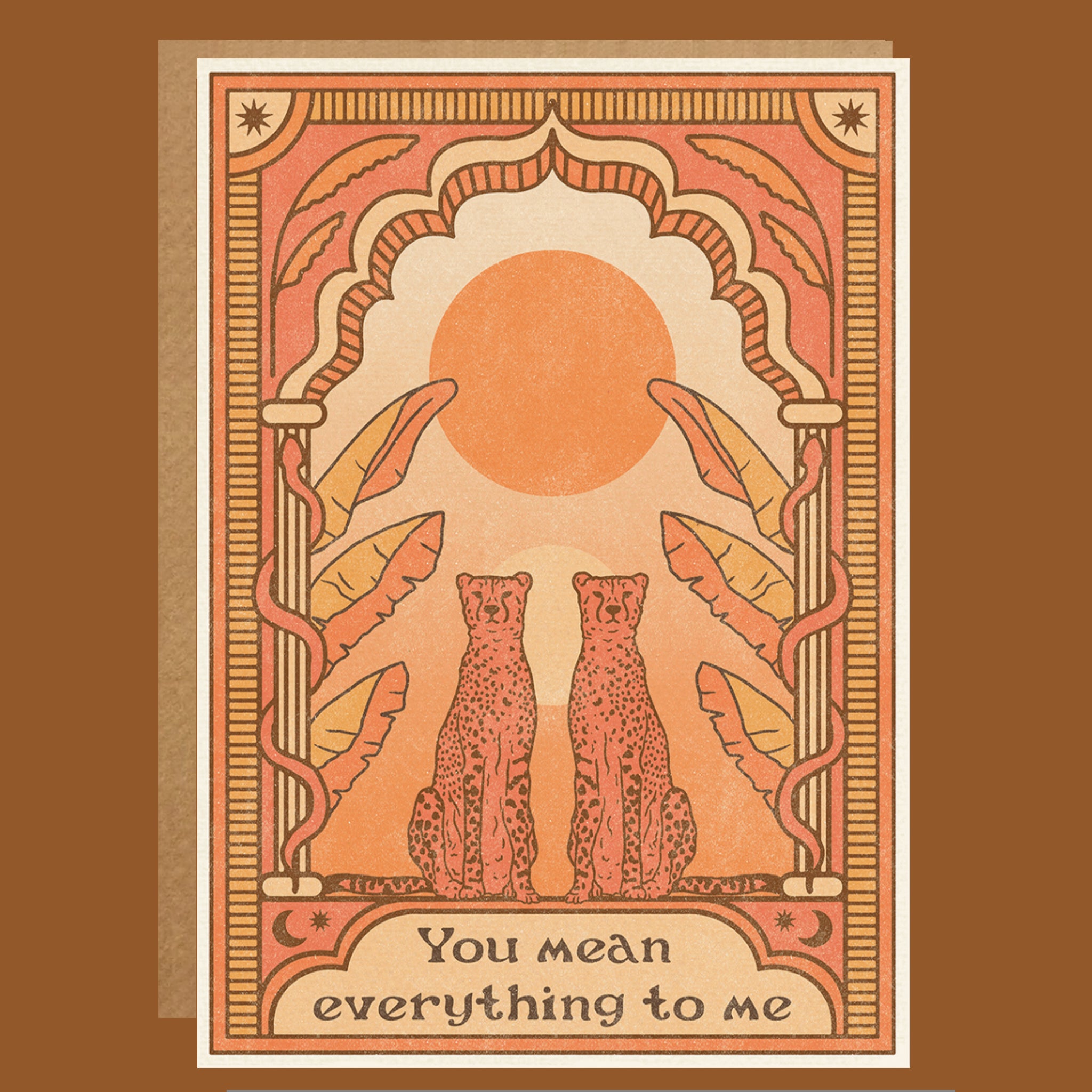 Greeting card with two cheetahs under a sun, surrounded by decorative elements on a brown background.