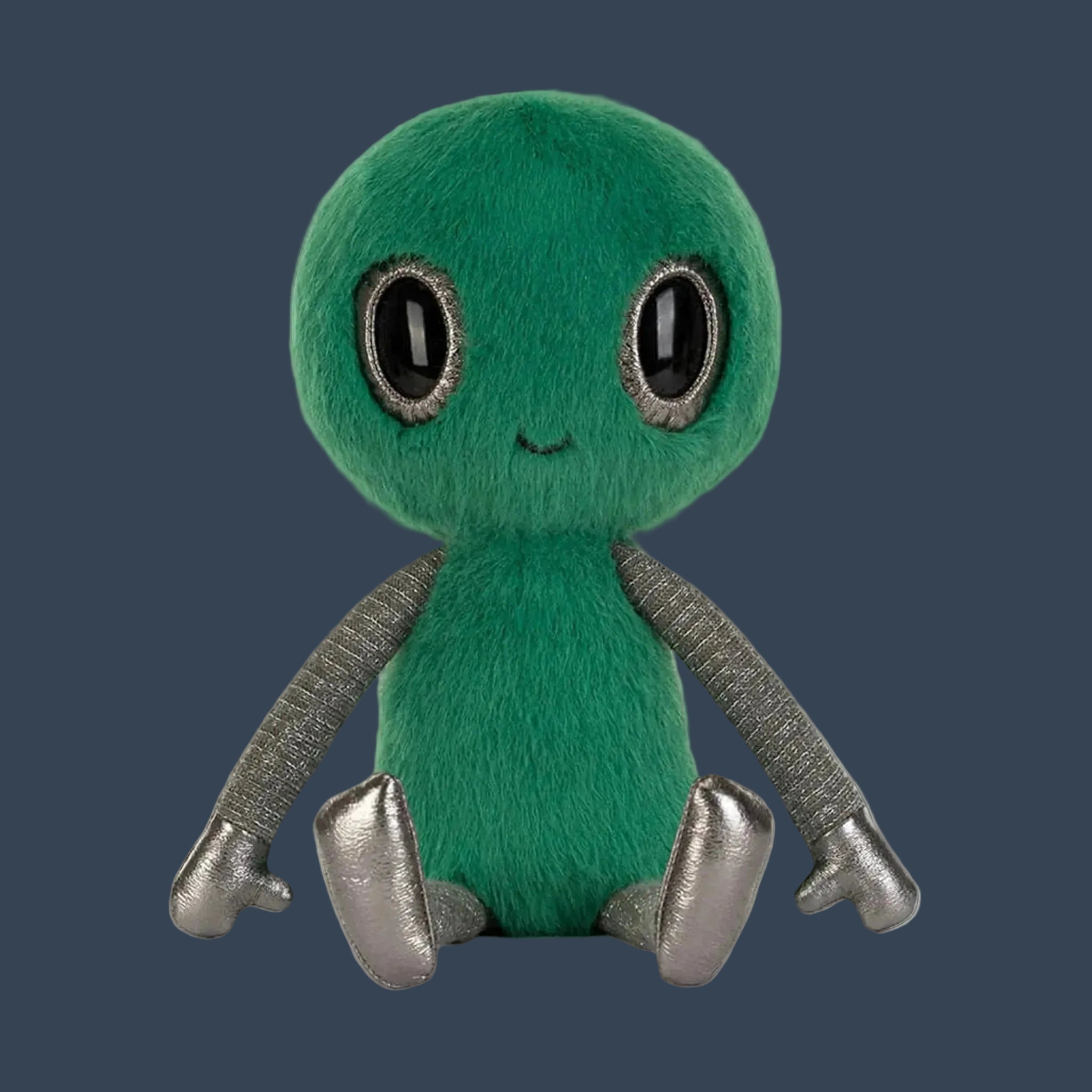 A green fuzzy alien shaped stuffed toy. 