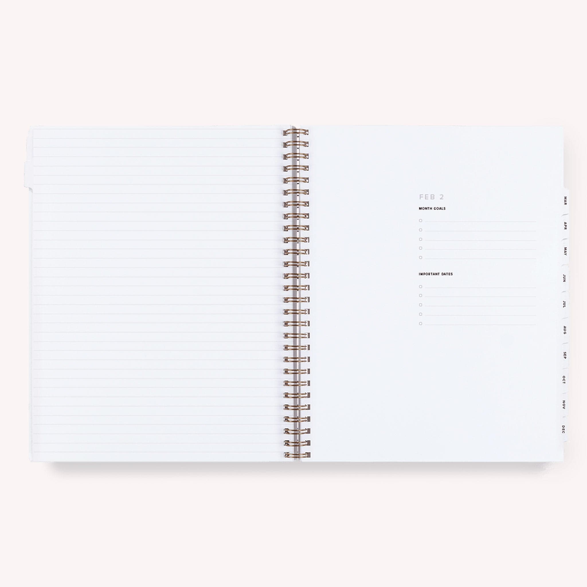 A lavender yearly planner that&#39;s gold spiral bound. The inside features daily to-do&#39;s, a notes page at the end of each month and a monthly view as well.
