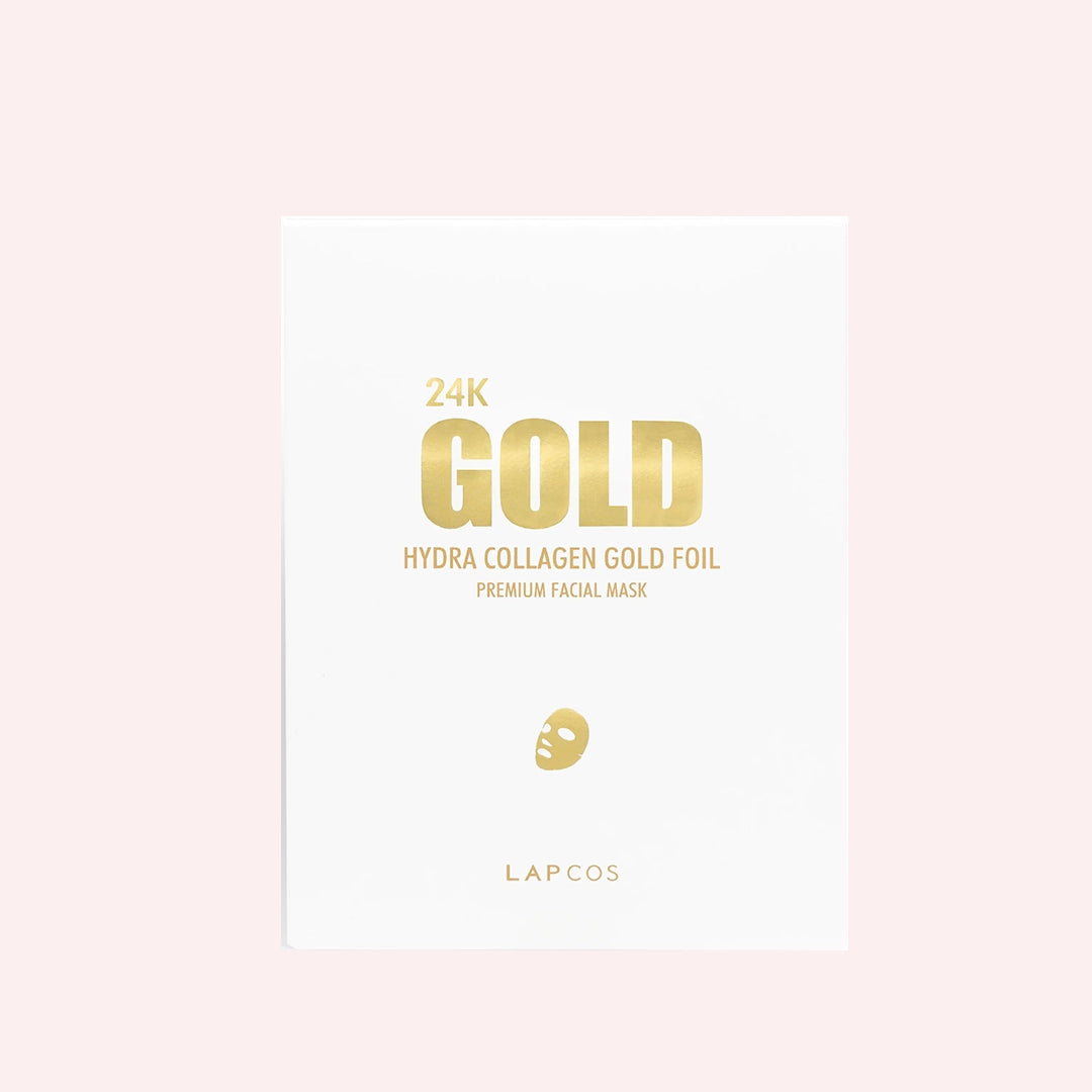 On a light pink background is a white envelope package that holds the gold face mask inside along with gold text on the front that reads, "24k Gold Hydra Collagen Gold Foil Premium Facial Mask". 