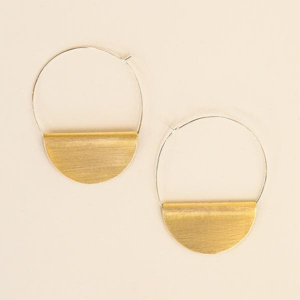 Photo of a pair of hoop earrings on a white background. Earrings have a thin silver wire hoop with a half circle of brass folded over the bottom of the wire circle. 
