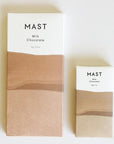 Two different sized rectangular bars of chocolate that read, "Mast Milk Chocolate" at the top in black letters along with a two toned wrapper that is brown and white. 