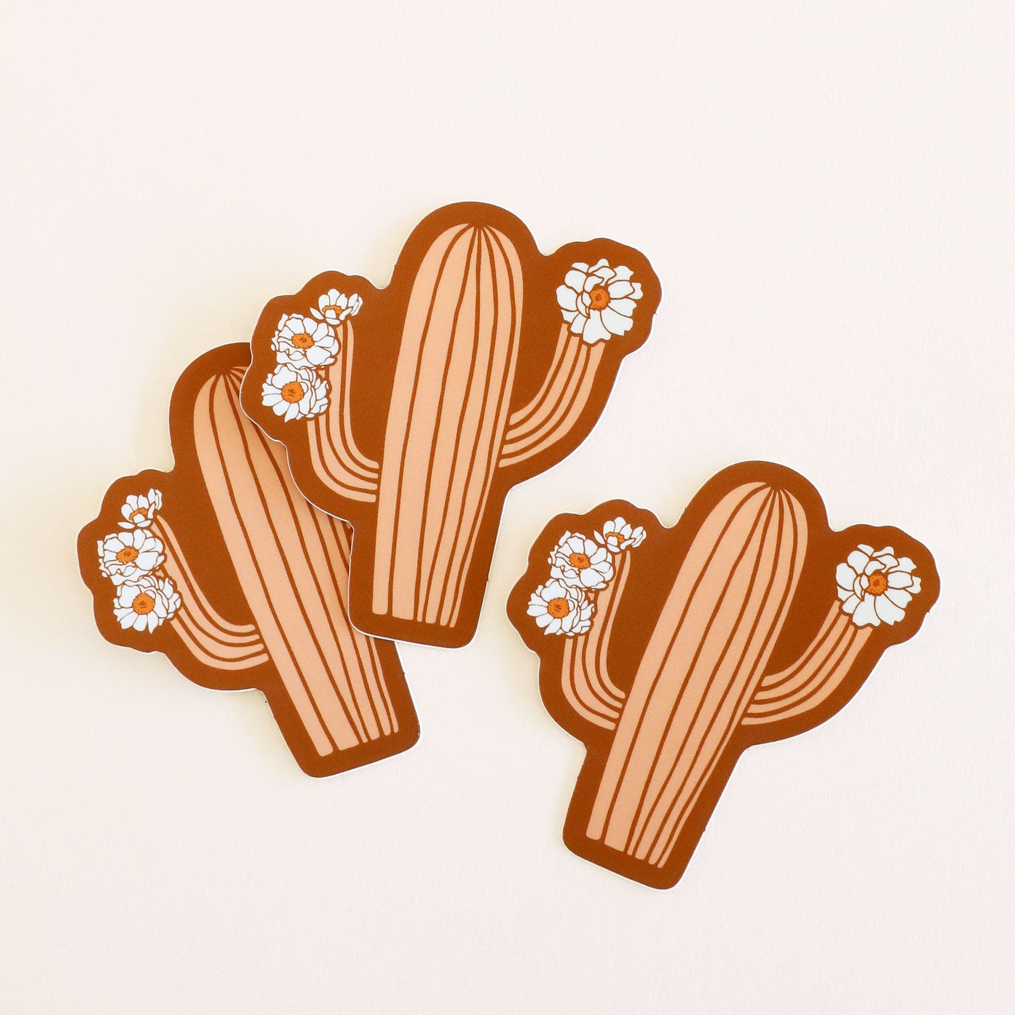 Three salmon pink cactus stickers with cactus flowers on each arm.