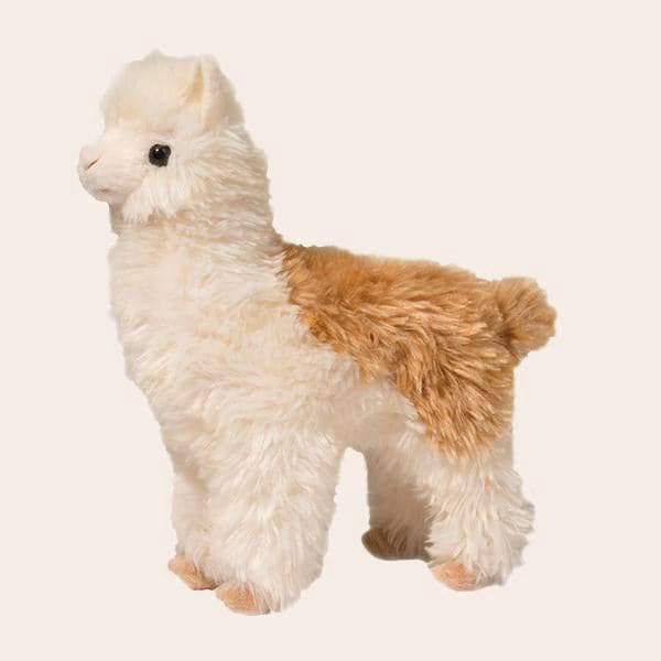Furry stuffed cream colored alpaca with caramel colored spot on back.