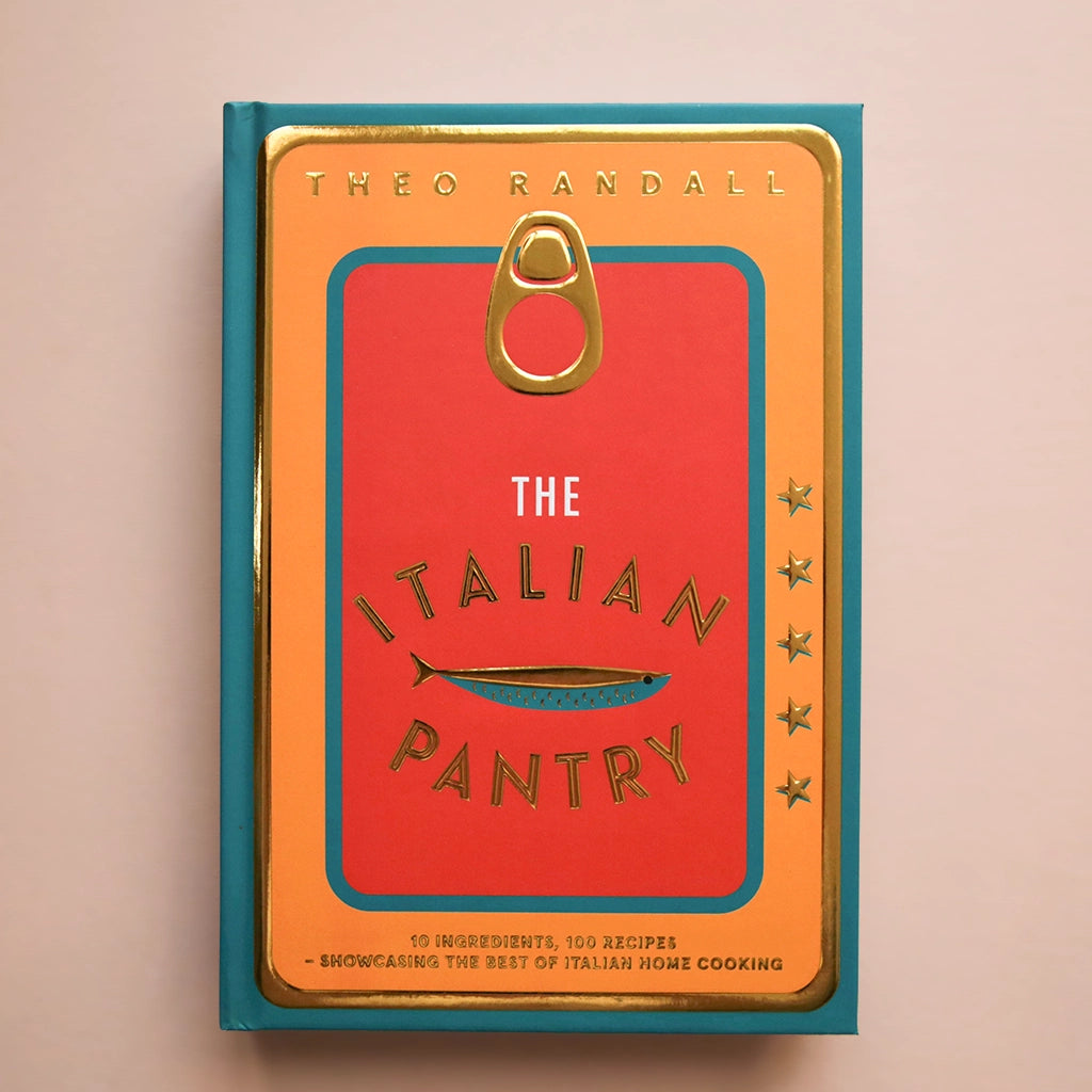 A vibrant book cover made to look like the top of a tin fish container with a teal blue border, an orange layer and then a red center along with the title, "The Italian Pantry".