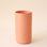 A terracotta ceramic vase with a simple cylinder design. 