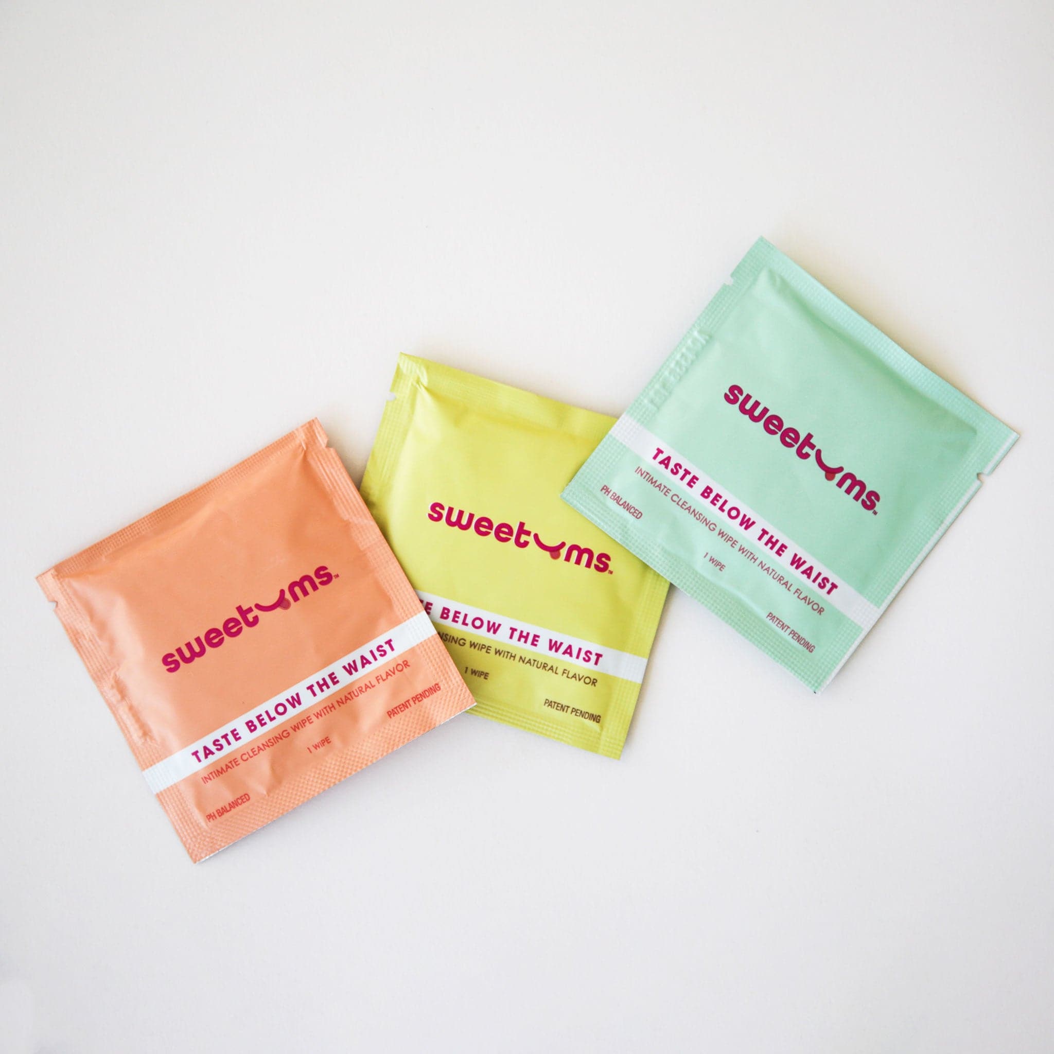 Individual packets of intimate cleaning wipes. Each scent has a different color packaging, and this watermelon flavor is light blue.