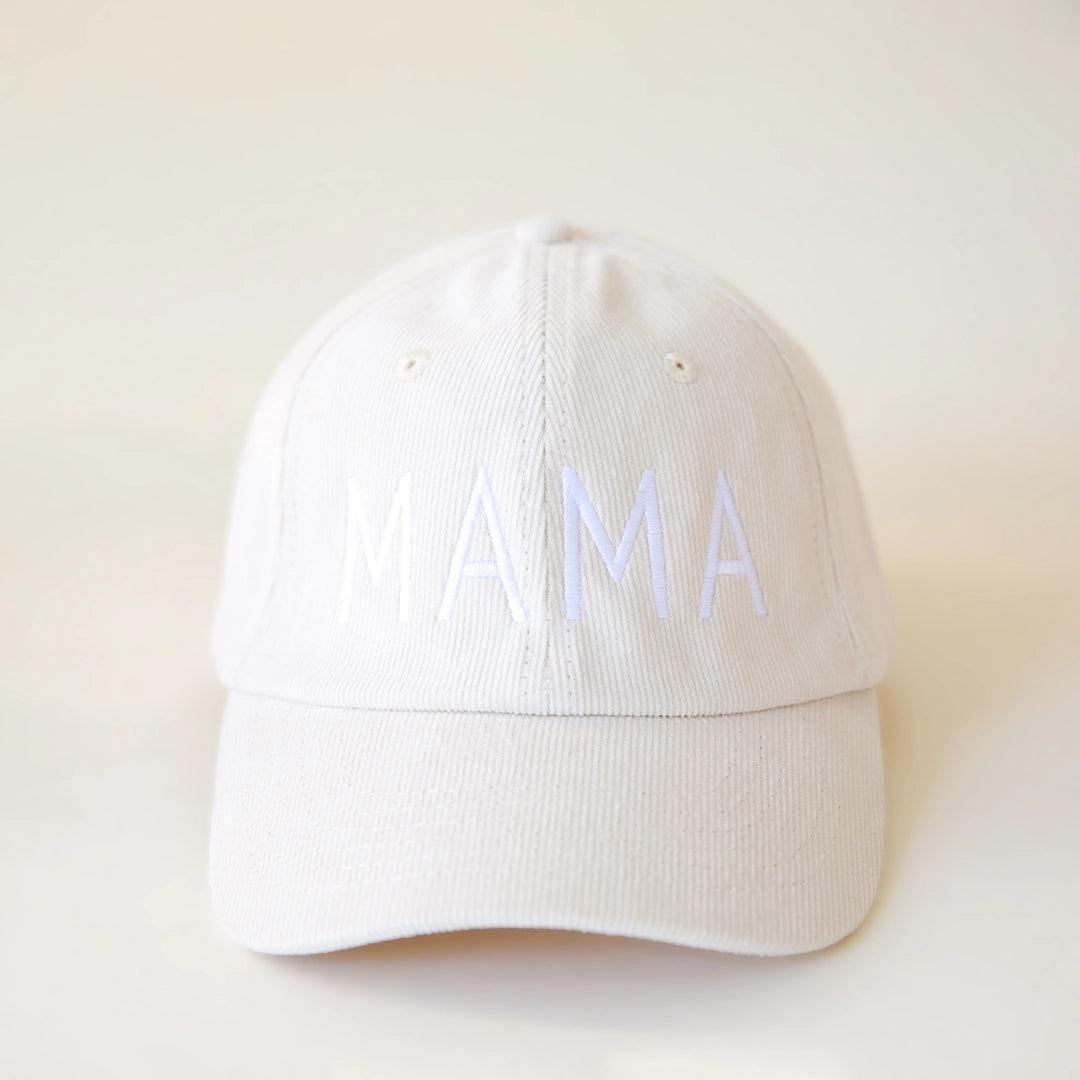 An ivory colored corduroy baseball hat with embroidered lettering that reads, &quot;MAMA&quot; in white across the front.