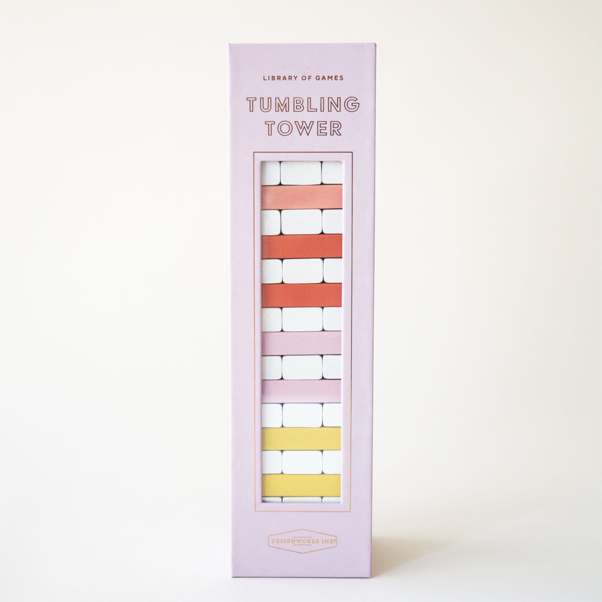 Against a white background is a light purple box with a set of wood blocks stacked upon one another ranging from white to shades of pink, red, and yellow along with letters at the top of the box that read, "Tumbling Tower".