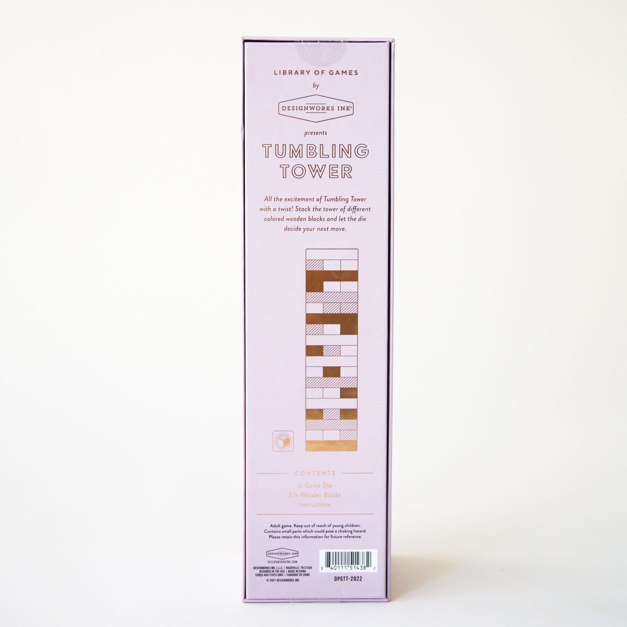 Against a white background is a light purple box with a set of wood blocks stacked upon one another ranging from white to shades of pink, red, and yellow along with letters at the top of the box that read, "Tumbling Tower". The back of the box showing the contents of the box which include 1 game die, 57 wooden blocks and instructions.