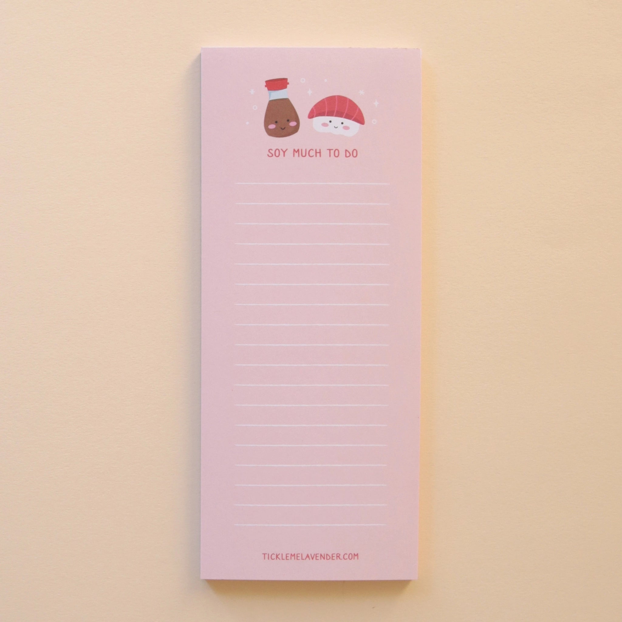 A light pink note pad with white lines for writing and a soy sauce and red tuna sashimi graphic at the top both with smiling faces and red text underneath that reads, &quot;Soy Much To Do&quot;.